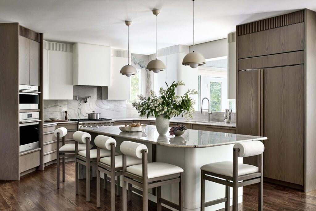 Modern neutral kitchen interior with marble island by Andrew Suvalsky Designs in Great Falls Virginia.